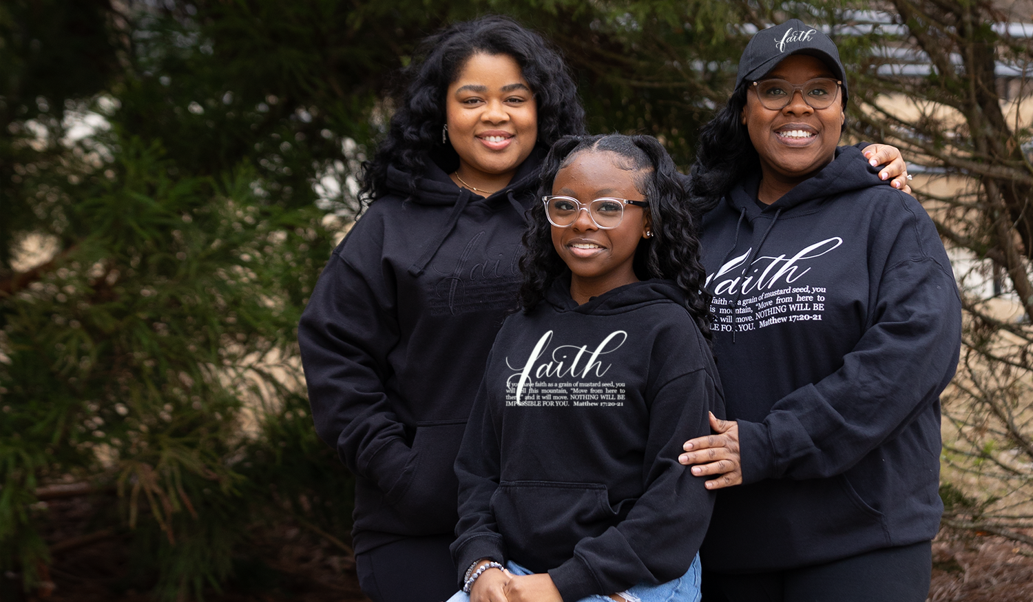 family outdoors wearing inspirational sweatshirts